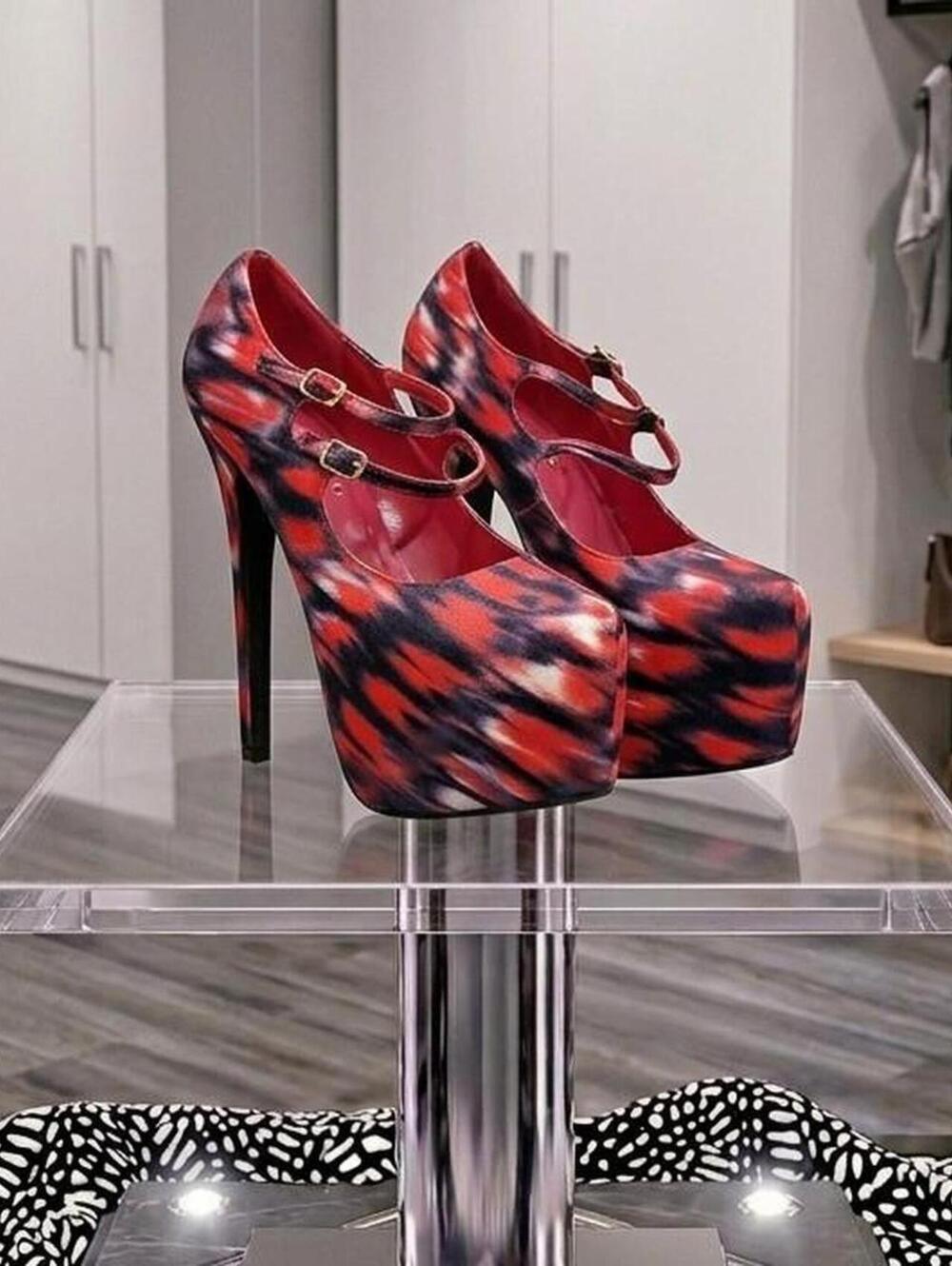Bold platform Mary Janes. Double-strap with gold-tone buckles.